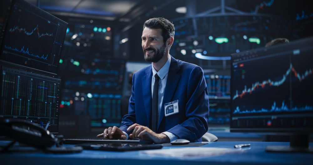 Male Specialist Typing on Keyboard, Analyzing Financial Market Reports with Graphs and Ticker Charts.