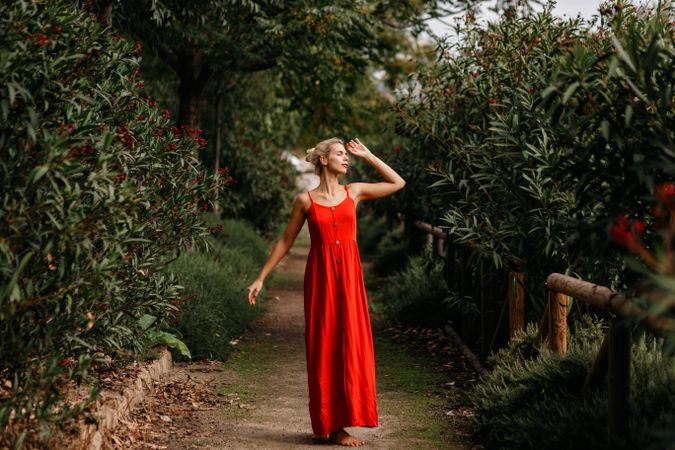 Dreamy young woman in summer garden