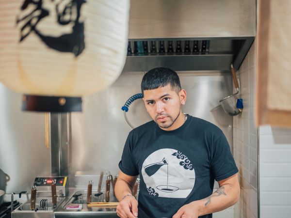 Handsome male cooking in kitchen