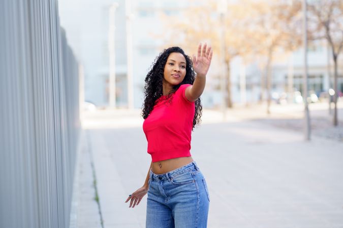 A Confident Young Woman Posing Outdoors with a Great Sense of Style and Attitude