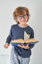 Smiling boy with open book