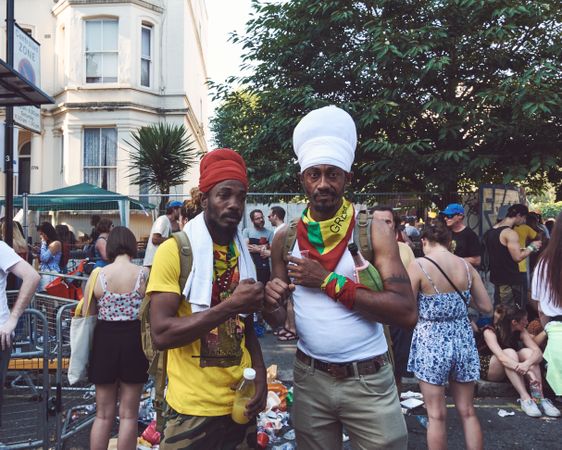 London, England, United Kingdom - August 25th, 2019: Two men fist bump at Notting Hill Carnival