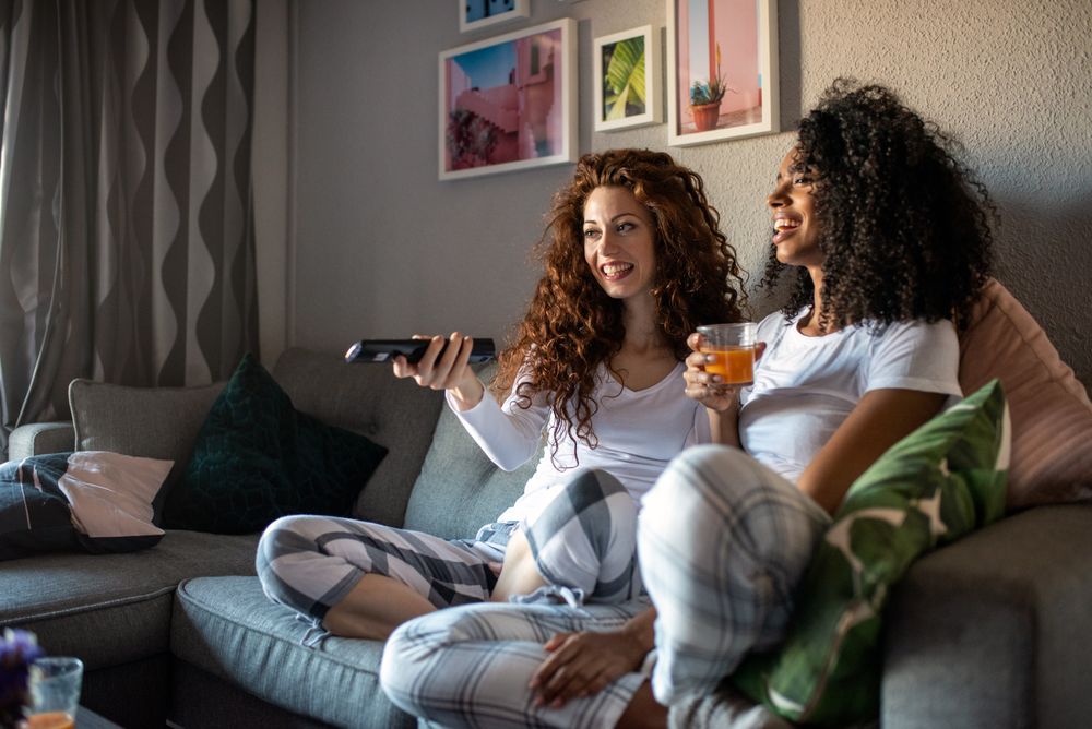 Young women on the sofa watching tv