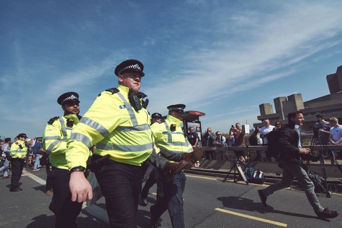 London, England, United Kingdom - April 19th, 2019: Police carrying protester in street