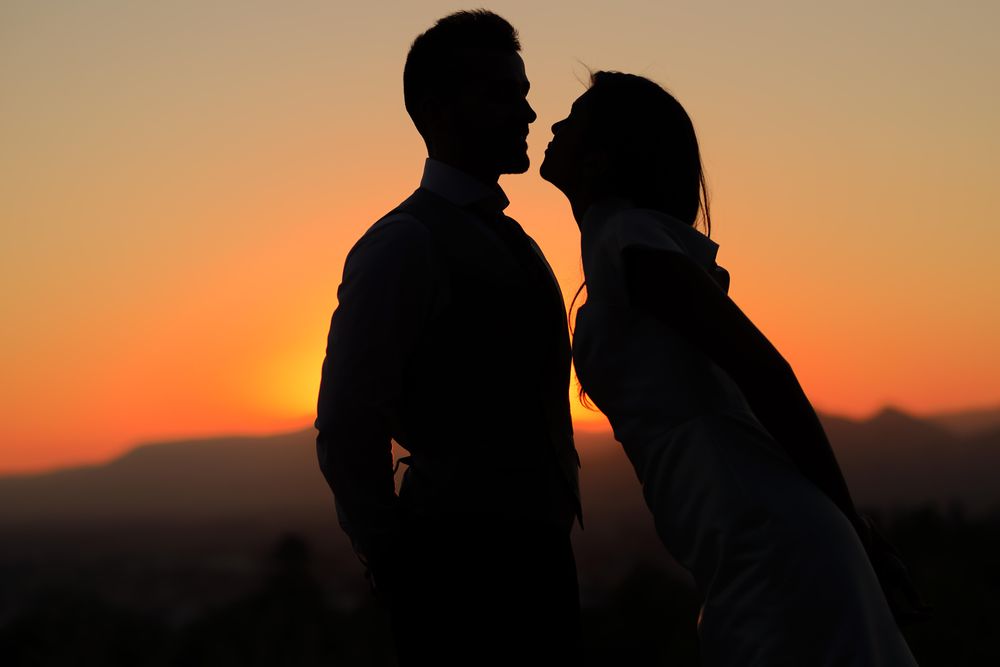 Outline of male and female couple at dusk