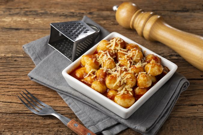 Gnocchi with tomato sauce and grated Parmesan cheese.