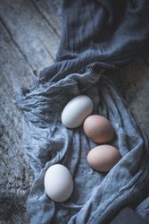 Raw eggs on tablecloth