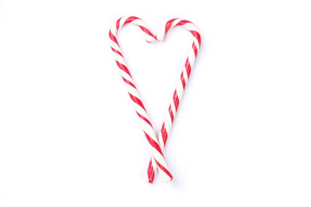 Sweet candy canes isolated on blank background
