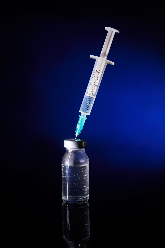 Medical injection with vaccine in studio