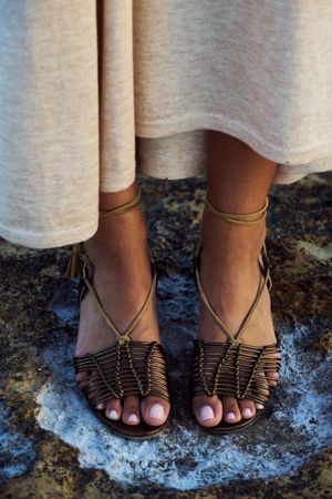 Summer sandals on young woman feet