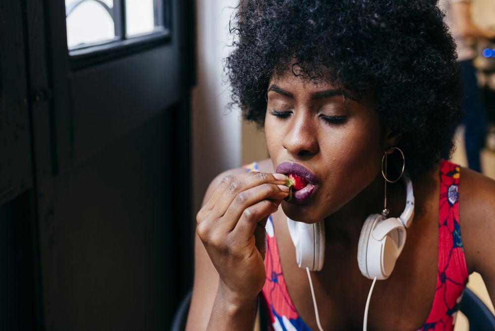 Woman eating in cafe