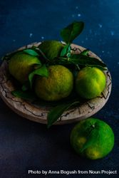 Bowl of fresh green tangerines 4dnBr0