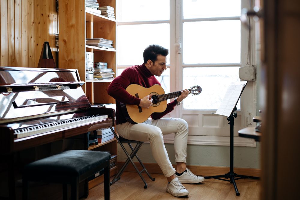Man playing guitar in studio