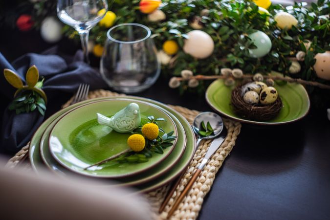 Decorative ceramic bird on plate for spring table setting