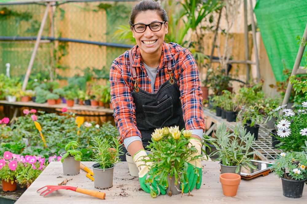 Cheerful gardener working with plants