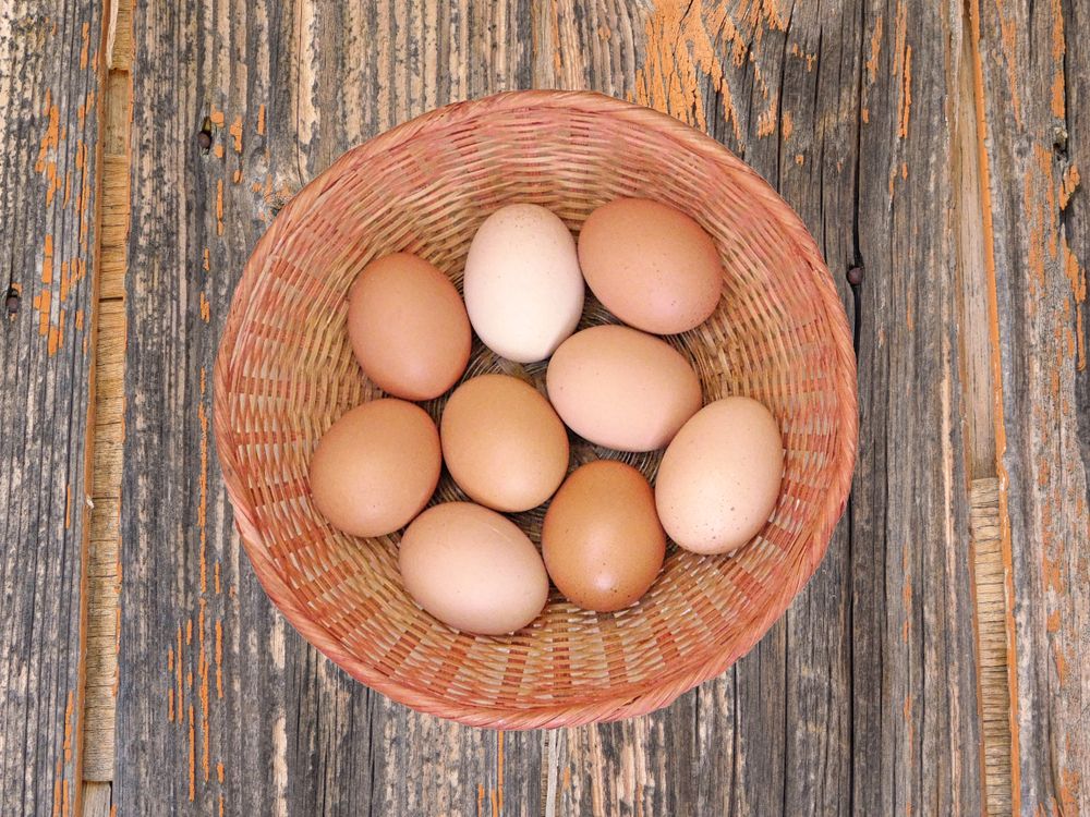 Eggs On The Wooden Background