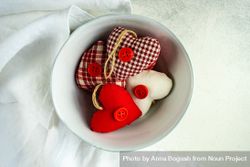 St. Valentines Day concept with top view of bowl of heart decorations 4d88kn