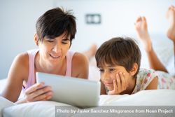 Woman reading to her daughter on tablet 42ALK5