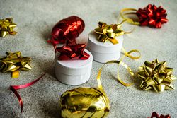 Christmas present box with gold and red ribbon