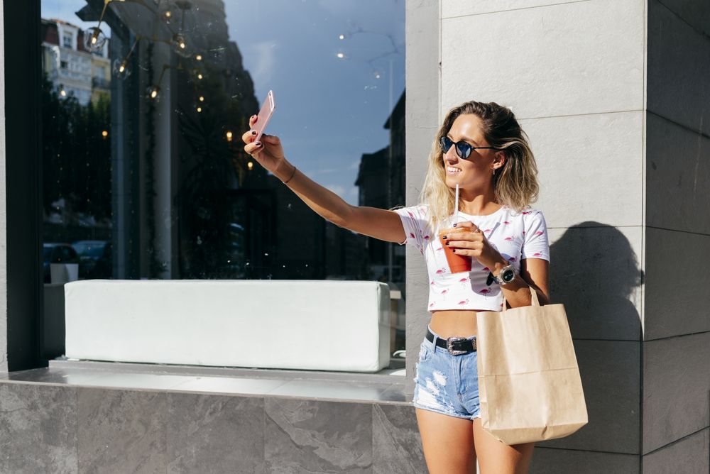 Cheerful woman leaving restaurant