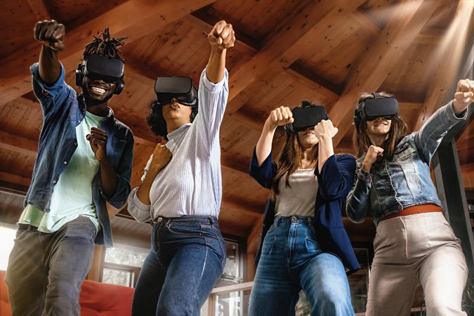 Young people portrait wearing VR headset and playing sport games in virtual reality cyberspace