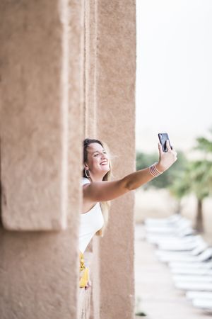 Woman making a selfie in balcony