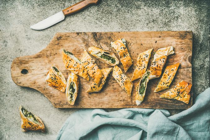 Turkish pastry, borek, sliced on wooden board