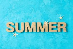 Inscription summer with starfishes on color background, space for text. Happy holidays