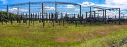 Electrical Transformer. Distribution of electric energy at a big substation with lots power lines on a sunny day