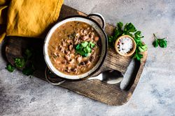 Top view of hearty bean soup with parsley