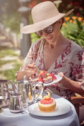 Woman Enjoying Breakfast in the Garden