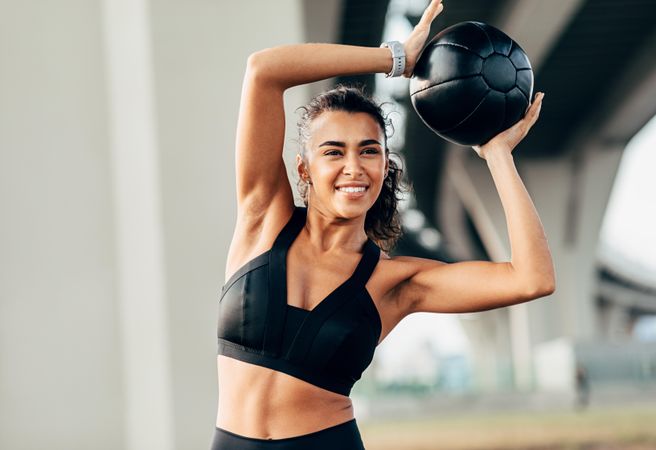 Healthy woman working out with ball