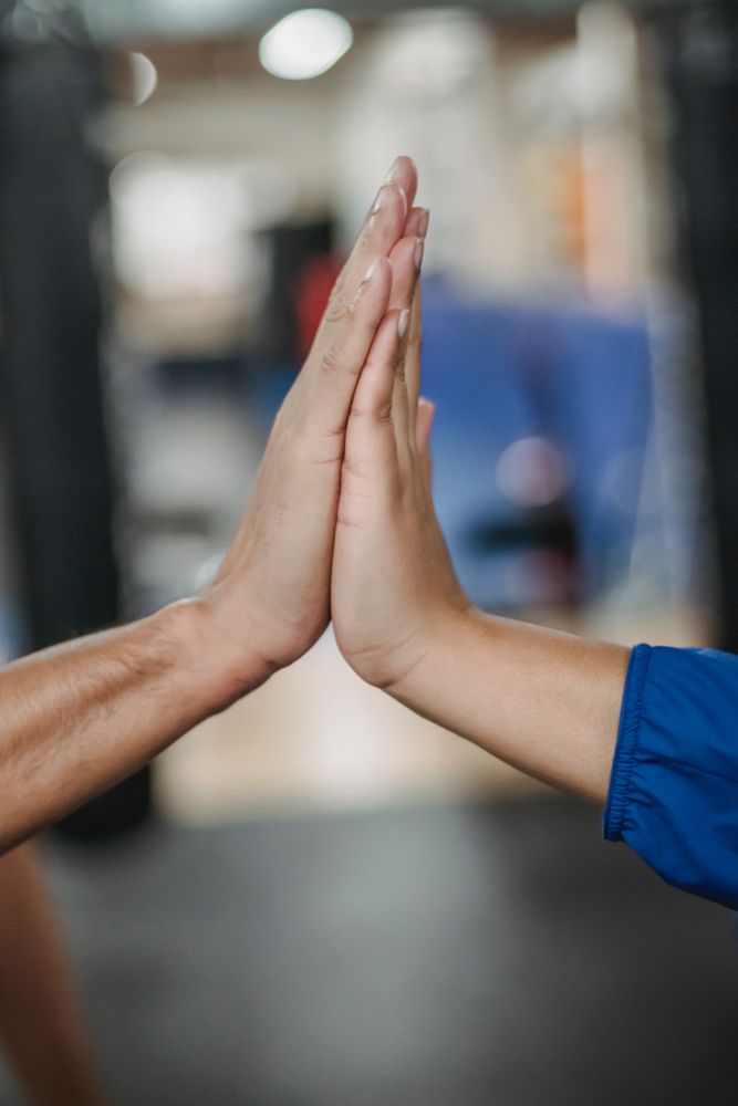 Two hands doing a high-five