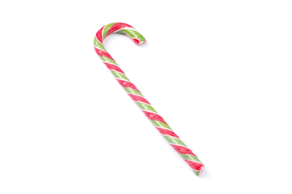 Sweet candy cane isolated on plain background