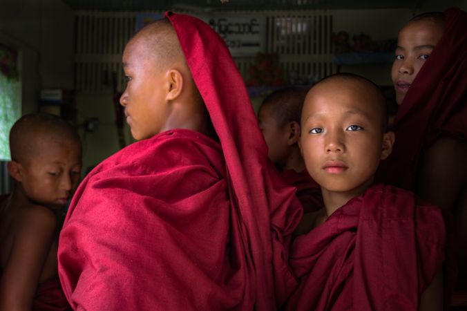Mandalay, Myanmar - June, 25 2012: Monk boys standing in queue for food