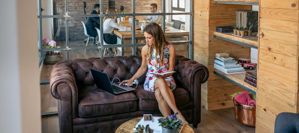 Woman working with laptop in a coworking office