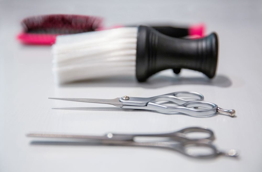 Side view of hairdressing tools on table