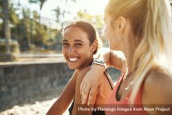 Woman smiling with her friend outside 0WrK6b