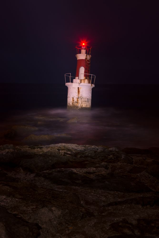 Lighthouse on rocky coastline