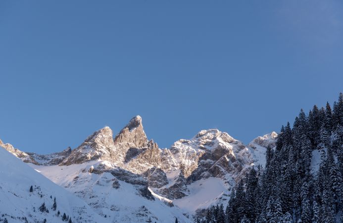 Snowy mountain peak close-up, on a December sunny day, in the Bavarian Alps