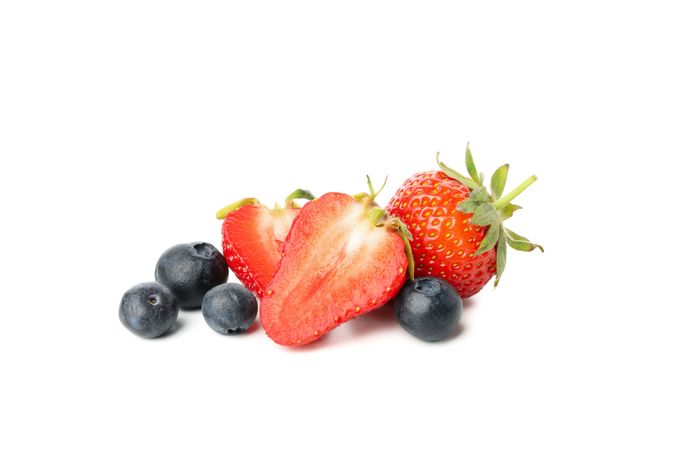 Tasty red strawberry and blueberry isolated on plain background