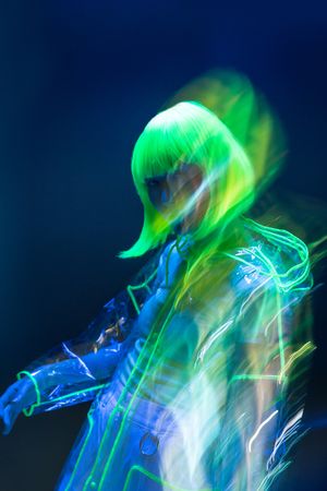 Asian woman posing in fluorescent light