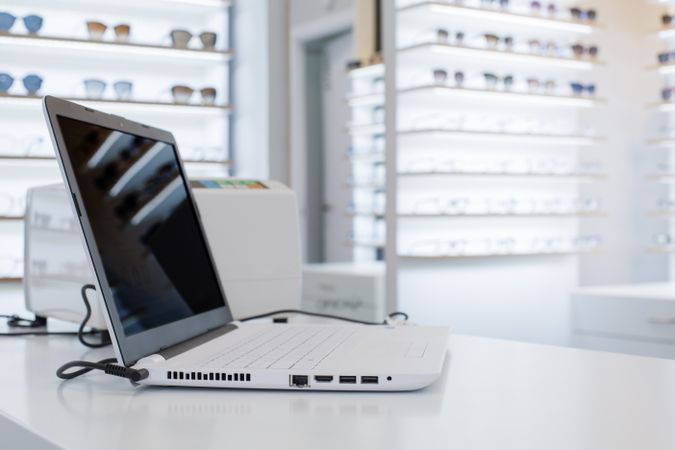 laptop on a table in a glasses store