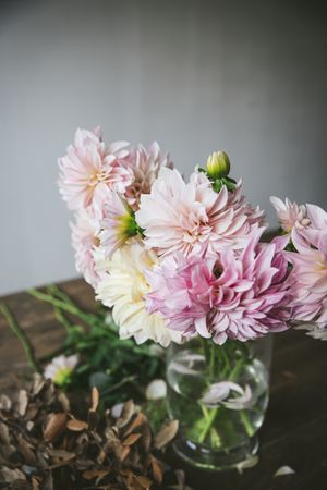 Bunch of flowers in vase on table