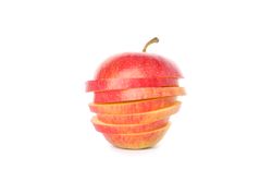 Sliced red apple isolated on light background