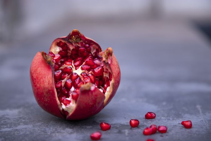 Pomegranate fruit on a concrete background