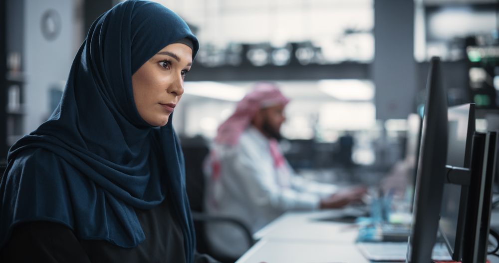 Young Woman Writing Software Code for an Innovative Internet and Software as a Service Project
