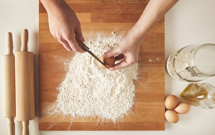 Hands preparing dough for pasta