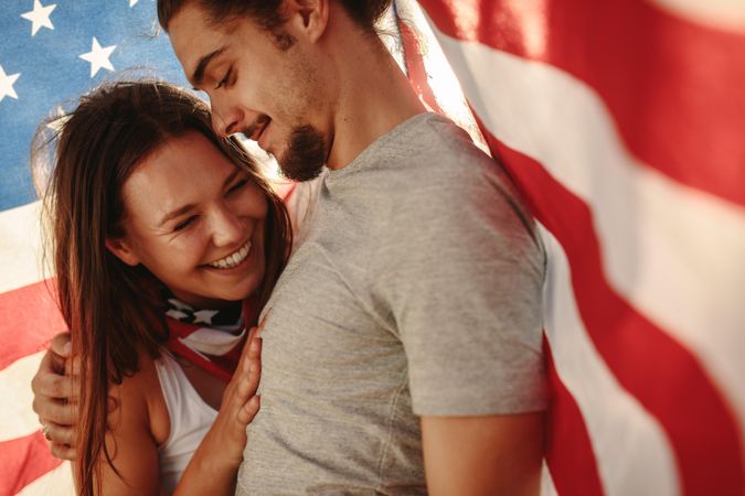 Couple in love with American flag around