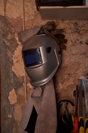 Welding mask in shabby workshop